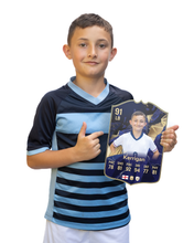 Load image into Gallery viewer, Creator Series 25 Best XI finished card held for scale
